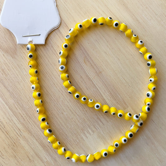 Yellow round Evil Eye 6mm